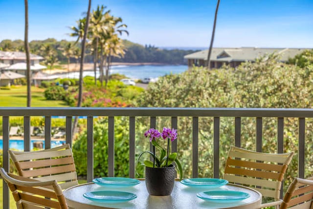 balcony featuring a water view