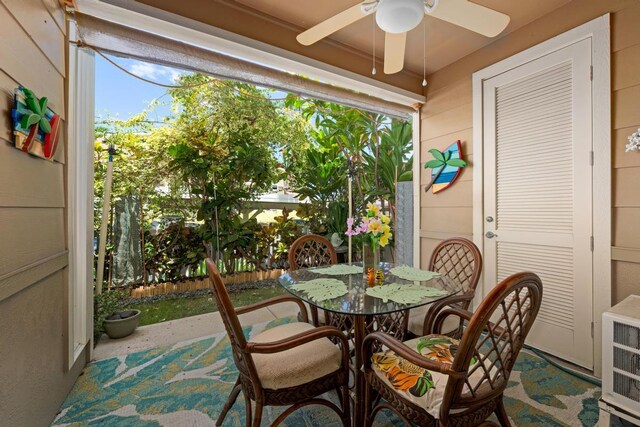 sunroom / solarium with ceiling fan