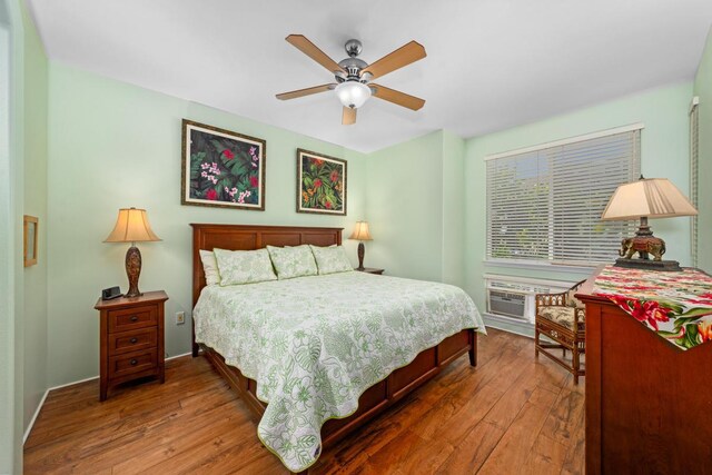 bedroom featuring ceiling fan and dark hardwood / wood-style flooring