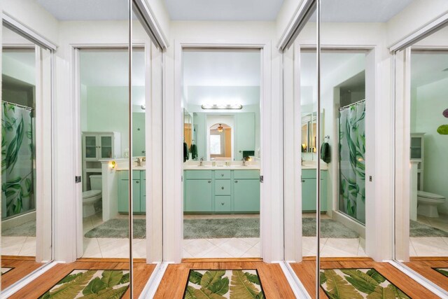 interior space featuring sink and light hardwood / wood-style flooring