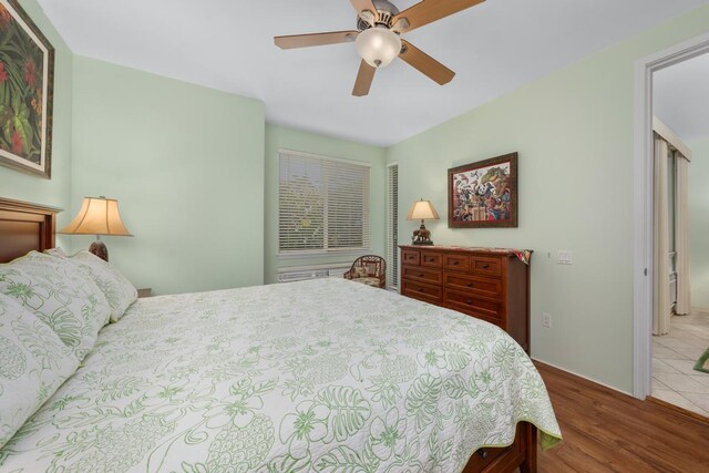 bedroom with hardwood / wood-style flooring and ceiling fan