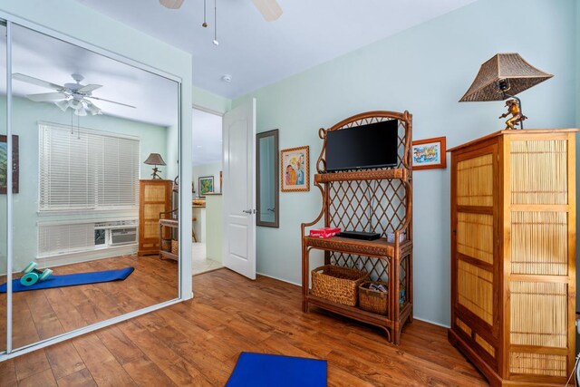 interior space featuring hardwood / wood-style floors and ceiling fan