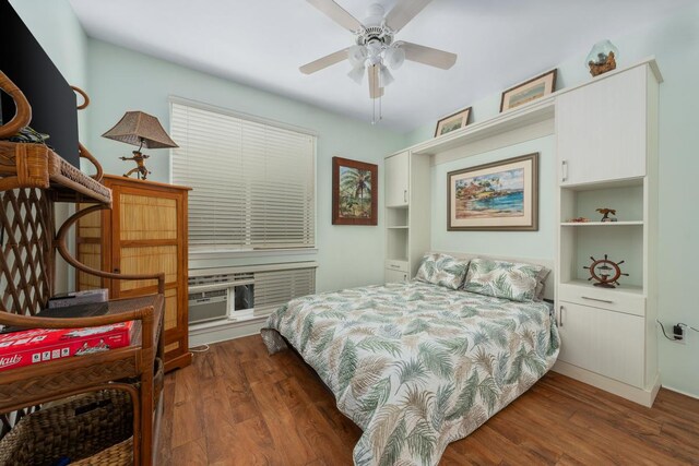 bedroom with ceiling fan and dark wood-type flooring