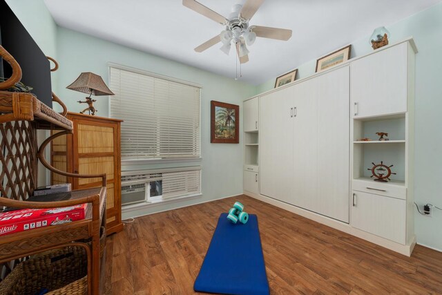 interior space featuring ceiling fan and dark hardwood / wood-style flooring