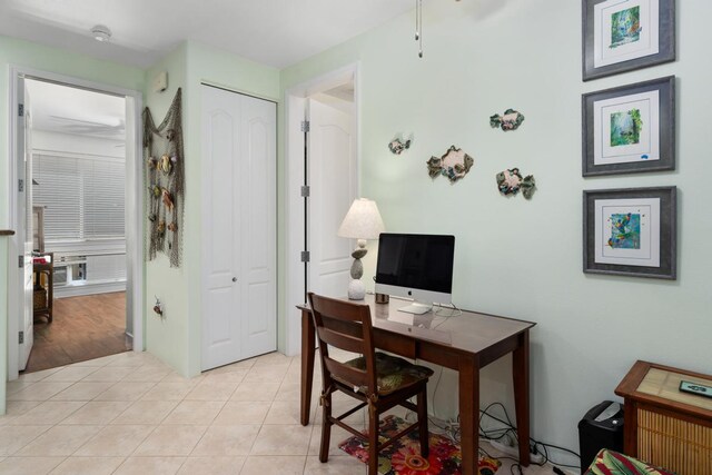 home office with light hardwood / wood-style floors