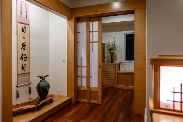 corridor with dark wood-type flooring