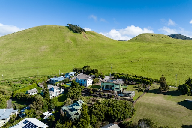 birds eye view of property featuring a mountain view and a rural view