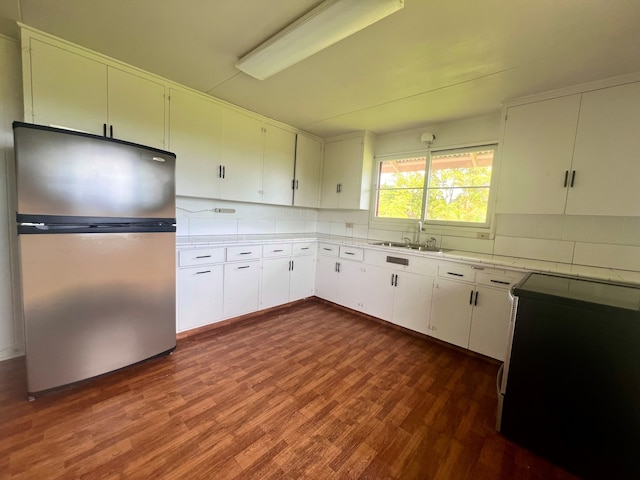 1395 Ainaola Dr, Hilo, HI 96720 - kitchen with freestanding refrigerator, range, a sink, backsplash, and light countertops
