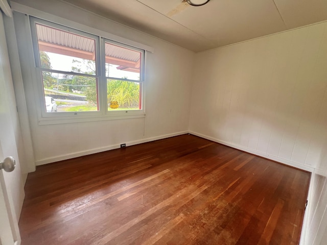 empty room with dark wood-type flooring