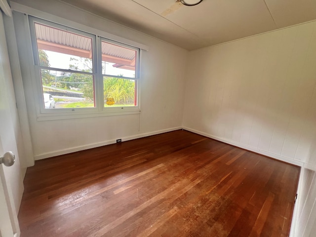 1395 Ainaola Dr, Hilo, HI 96720 - unfurnished room featuring dark wood-style flooring and baseboards
