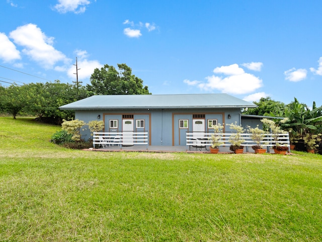 view of outbuilding with a yard