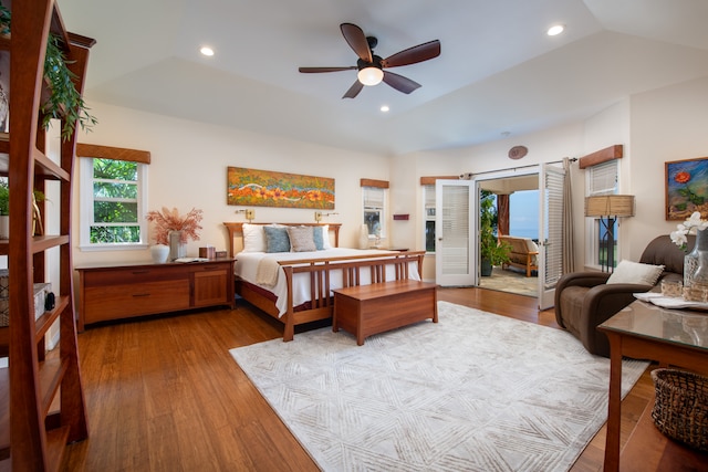 bedroom with wood-type flooring, lofted ceiling, and ceiling fan