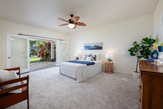 carpeted bedroom featuring ceiling fan and access to exterior