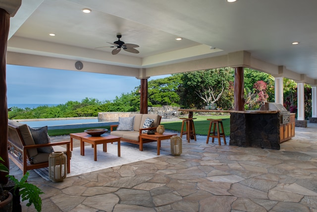 view of patio / terrace with ceiling fan, grilling area, and an outdoor living space