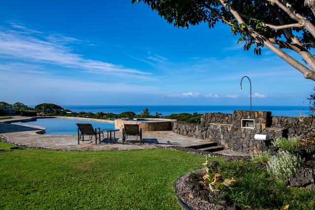 exterior space with a water view and a patio area