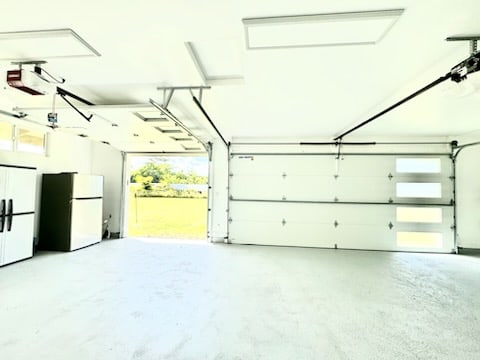 garage with white refrigerator