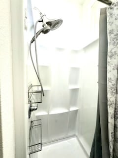 bathroom featuring walk in shower