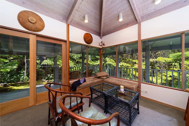 sunroom with vaulted ceiling with beams and wooden ceiling