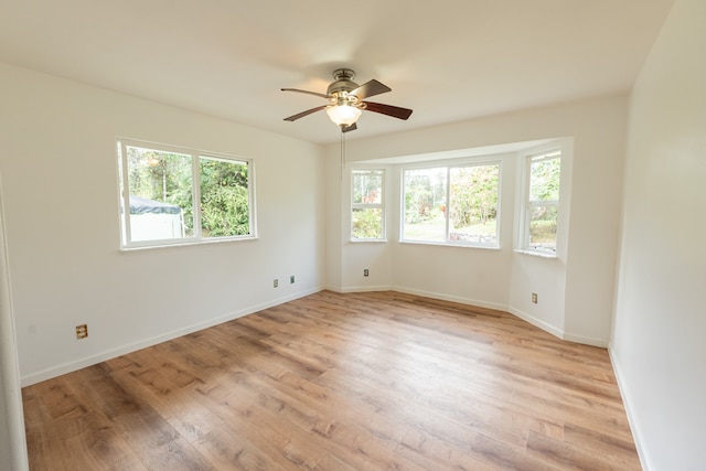 unfurnished room with light hardwood / wood-style floors and ceiling fan