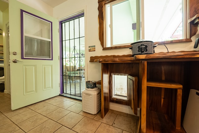 entryway featuring light tile patterned flooring