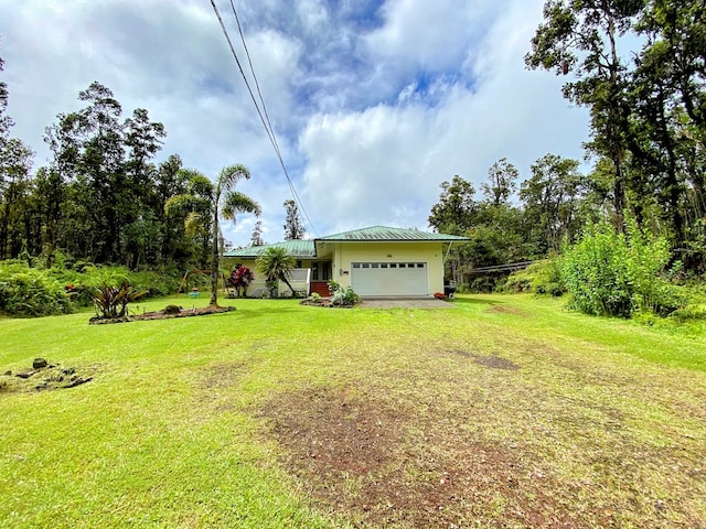 view of yard featuring a garage