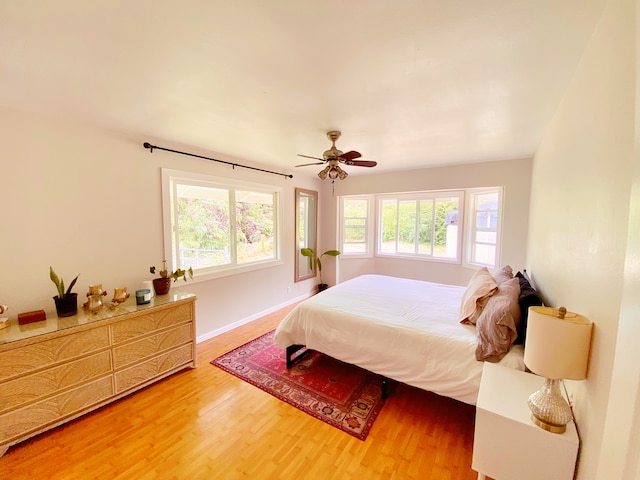 bedroom featuring ceiling fan and hardwood / wood-style flooring