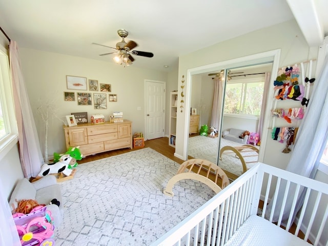 bedroom featuring wood-type flooring and ceiling fan