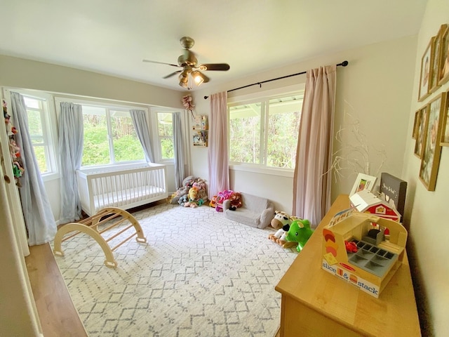 interior space with ceiling fan and hardwood / wood-style floors