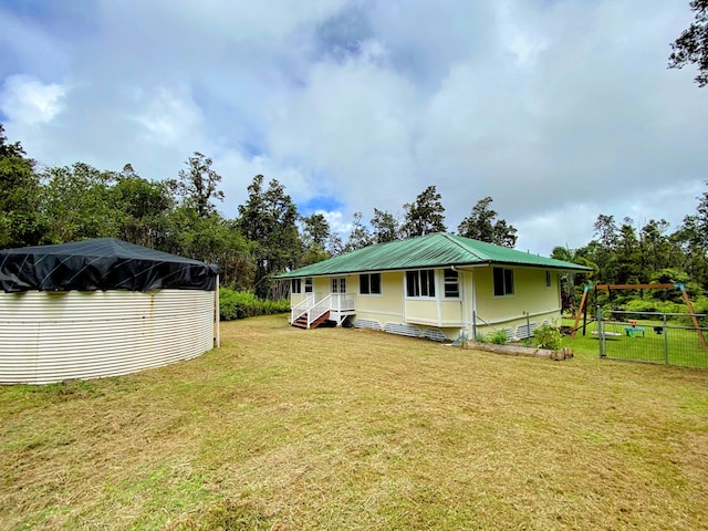 view of home's exterior with a yard