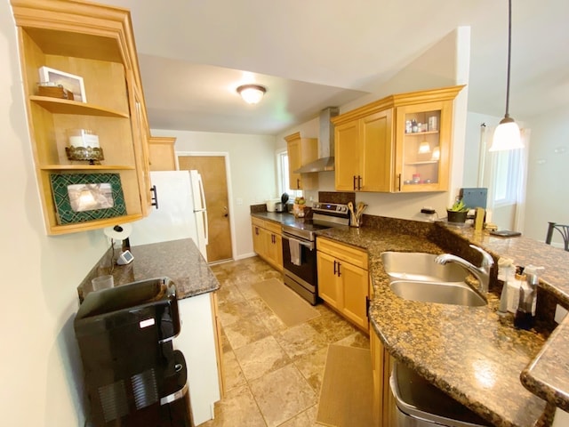 kitchen with sink, decorative light fixtures, wall chimney exhaust hood, stainless steel range with electric cooktop, and white fridge