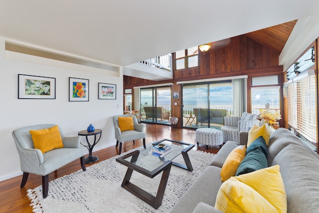 living room featuring wooden walls and hardwood / wood-style flooring