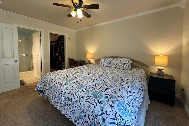 bedroom featuring a spacious closet, ceiling fan, a closet, and carpet flooring