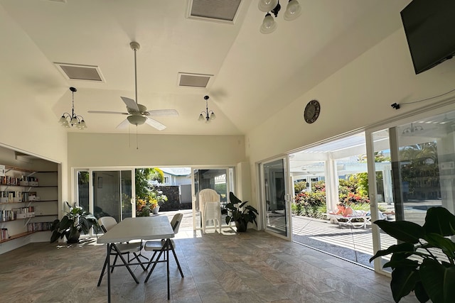 sunroom / solarium featuring ceiling fan and vaulted ceiling