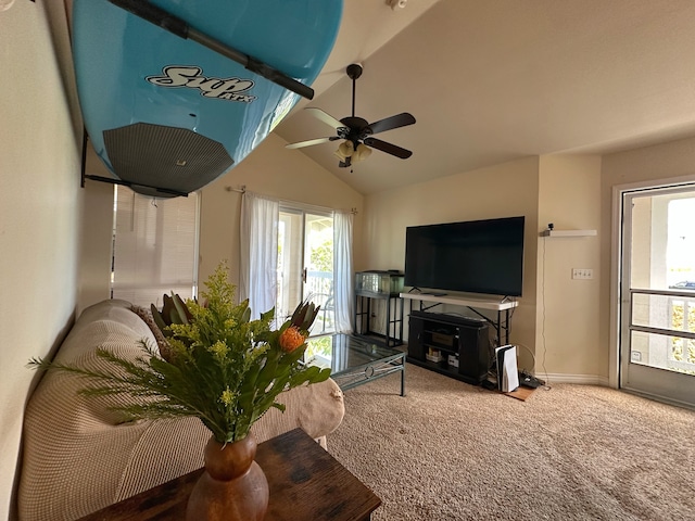 carpeted living room featuring ceiling fan and vaulted ceiling