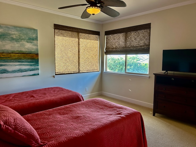 bedroom with light carpet, ceiling fan, and crown molding