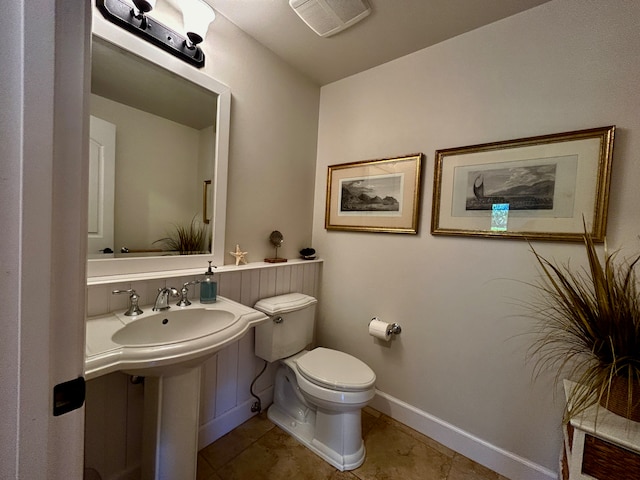 bathroom with tile patterned floors and toilet