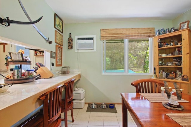 tiled dining area featuring a wall mounted AC