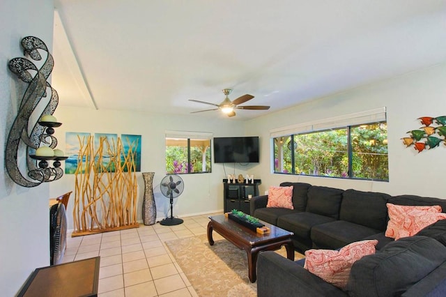 tiled living room with ceiling fan and a wealth of natural light