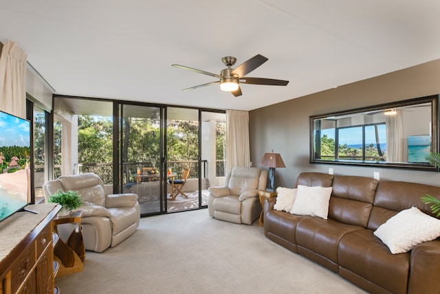 living room featuring light colored carpet and ceiling fan