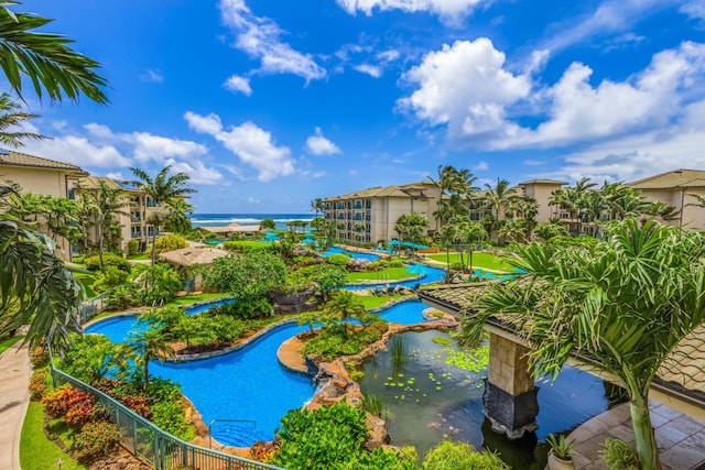 view of pool with a water view