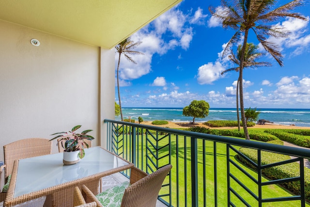 balcony with a view of the beach and a water view