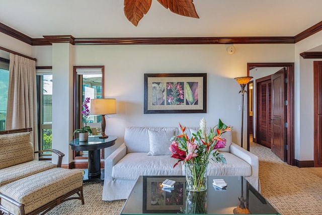 living room with crown molding and carpet