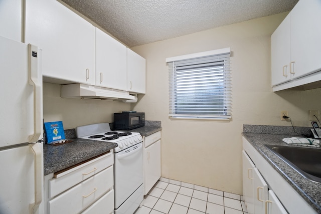 kitchen with light tile patterned floors, a textured ceiling, white cabinetry, sink, and white appliances