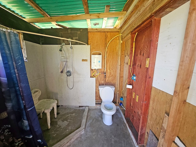 bathroom featuring wooden walls, toilet, curtained shower, and concrete flooring