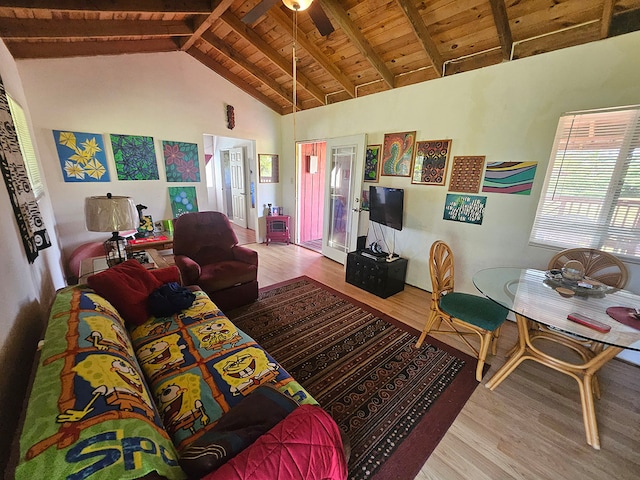 living room with beamed ceiling, ceiling fan, hardwood / wood-style floors, wood ceiling, and high vaulted ceiling