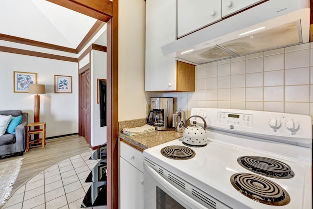 kitchen featuring white cabinets, light hardwood / wood-style flooring, white electric range, vaulted ceiling, and decorative backsplash