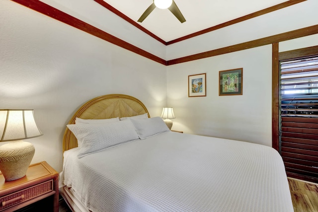 bedroom featuring wood-type flooring and ceiling fan