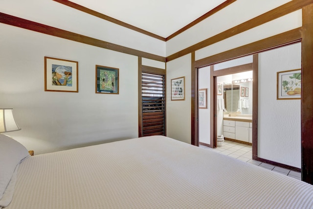 unfurnished bedroom featuring crown molding, ensuite bathroom, and light tile patterned floors