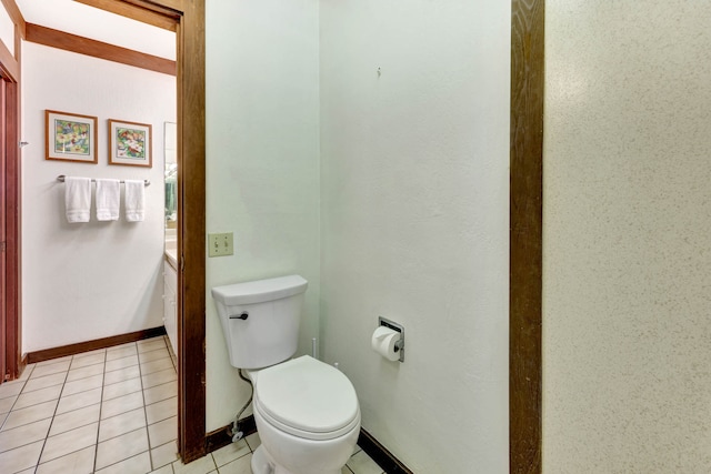 bathroom with tile patterned flooring and toilet