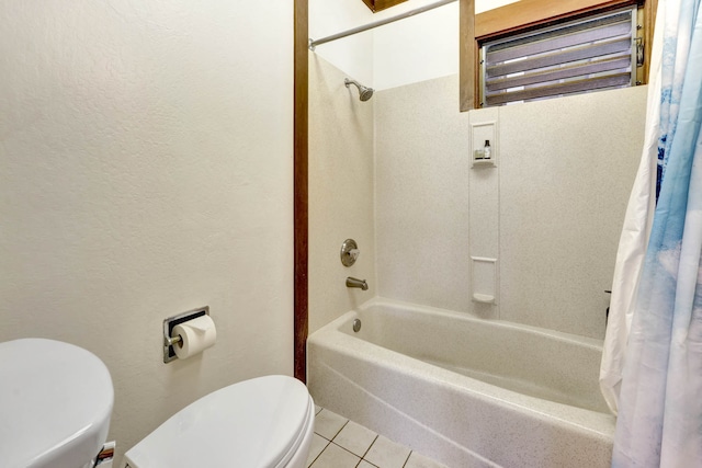 bathroom featuring shower / bath combination with curtain, tile patterned floors, and toilet